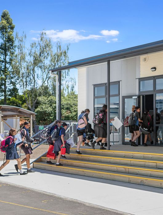School children entering classroom