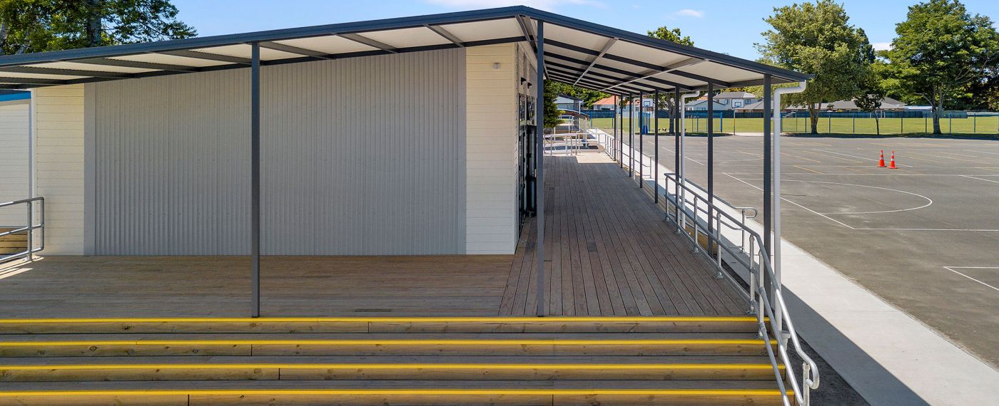 Classroom with outdoor decks looking over netball courts